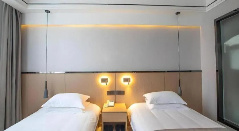 Bed in GELI Hotel Huainan Railway Station Sports Center