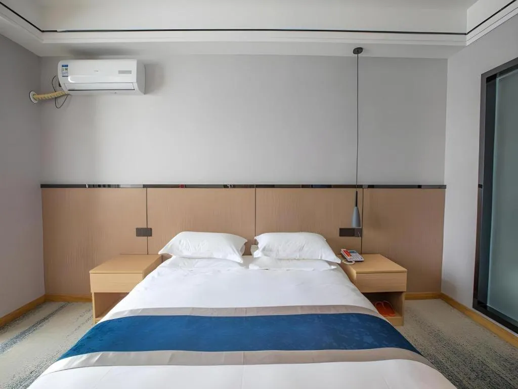 Bed in GELI Hotel Huainan Railway Station Sports Center