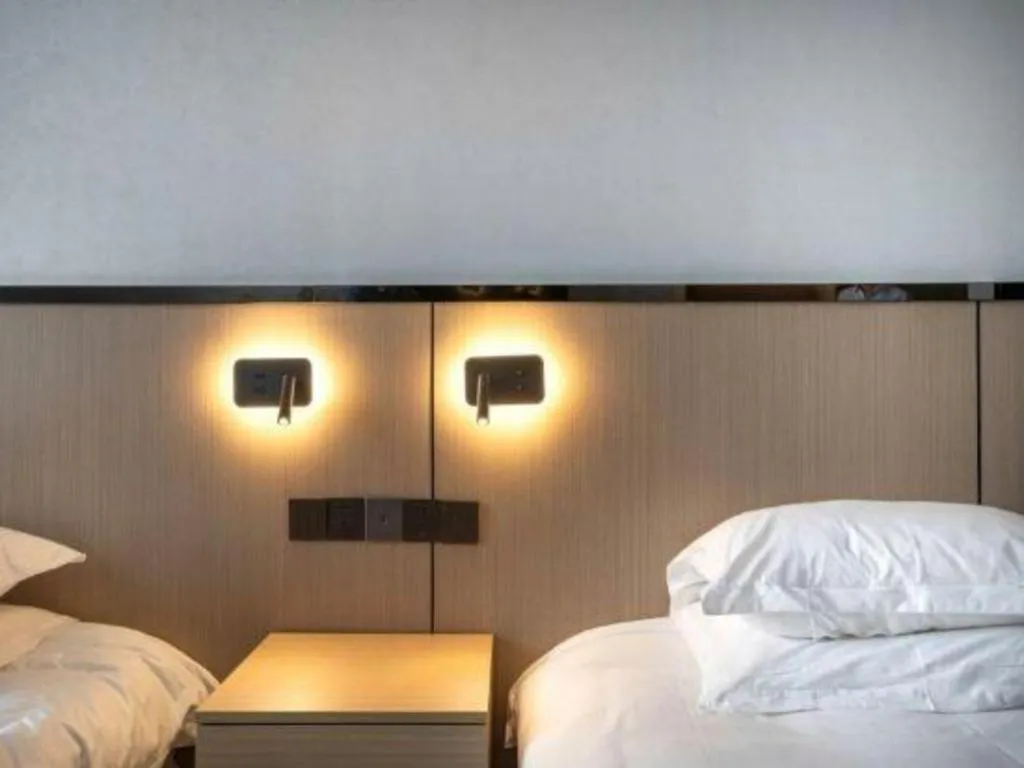 Bed in GELI Hotel Huainan Railway Station Sports Center