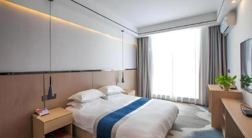 Bed in GELI Hotel Huainan Railway Station Sports Center
