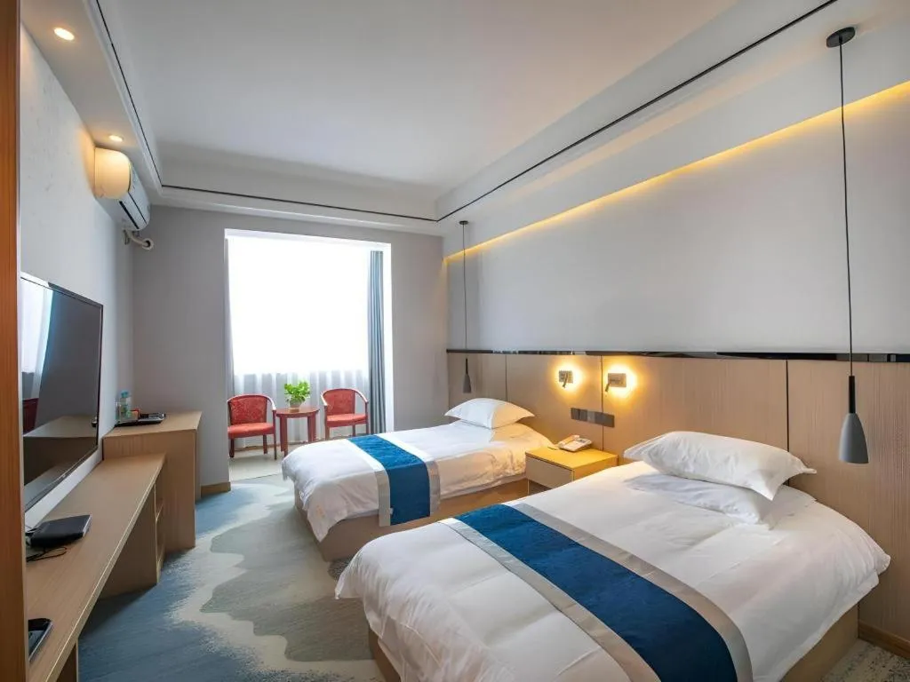 Bed in GELI Hotel Huainan Railway Station Sports Center