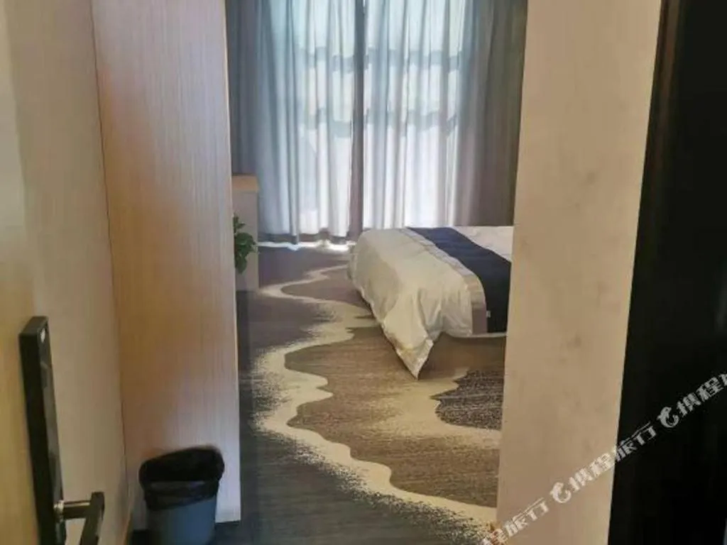 Bed in GELI Hotel Huainan Railway Station Sports Center