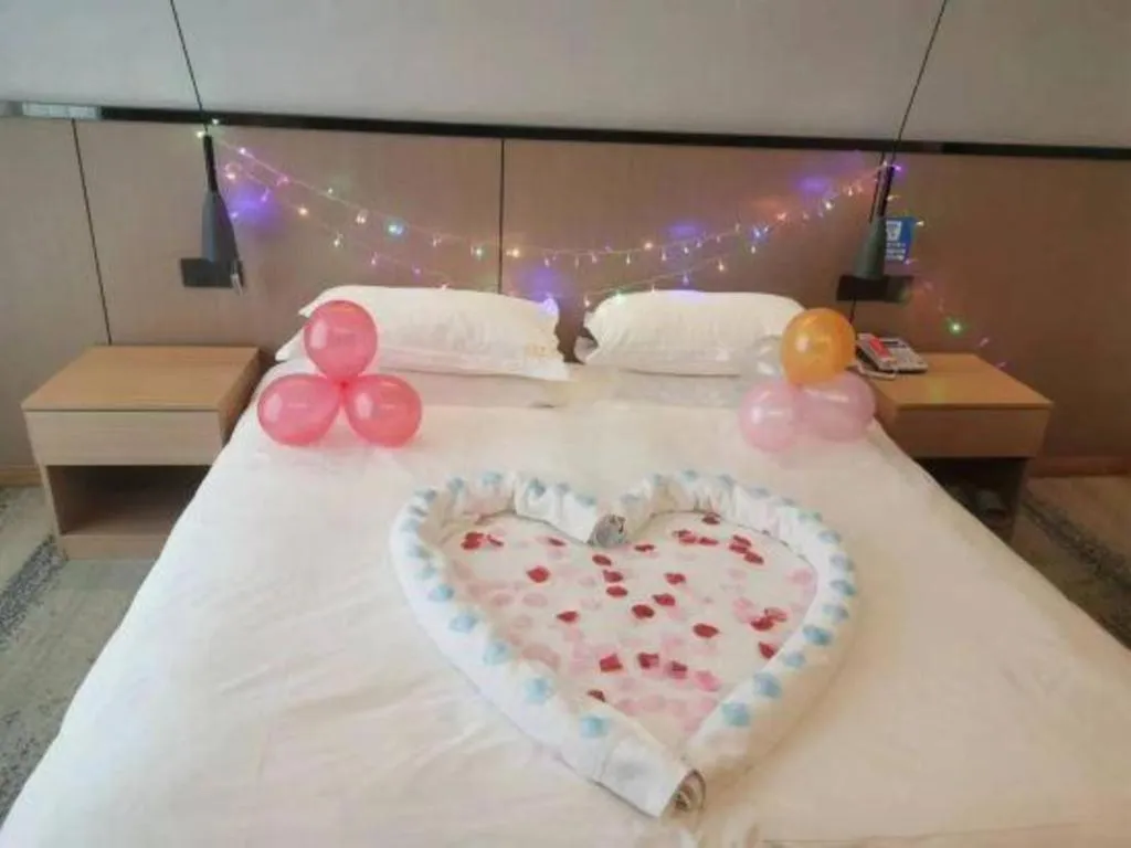 Bed in GELI Hotel Huainan Railway Station Sports Center