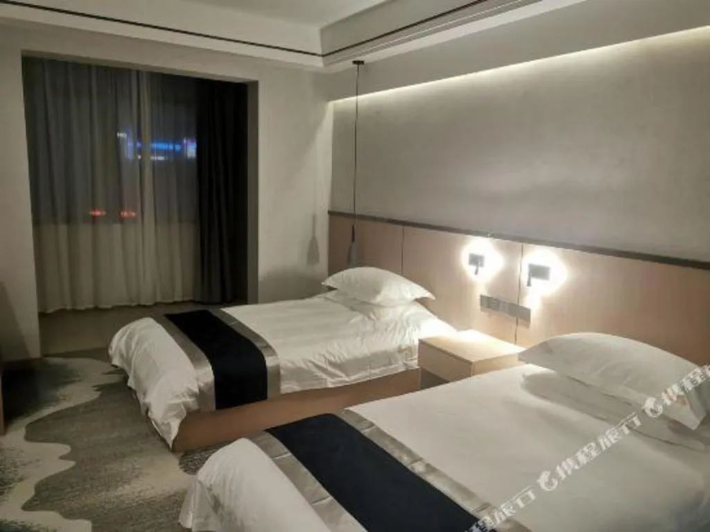 Bed in GELI Hotel Huainan Railway Station Sports Center