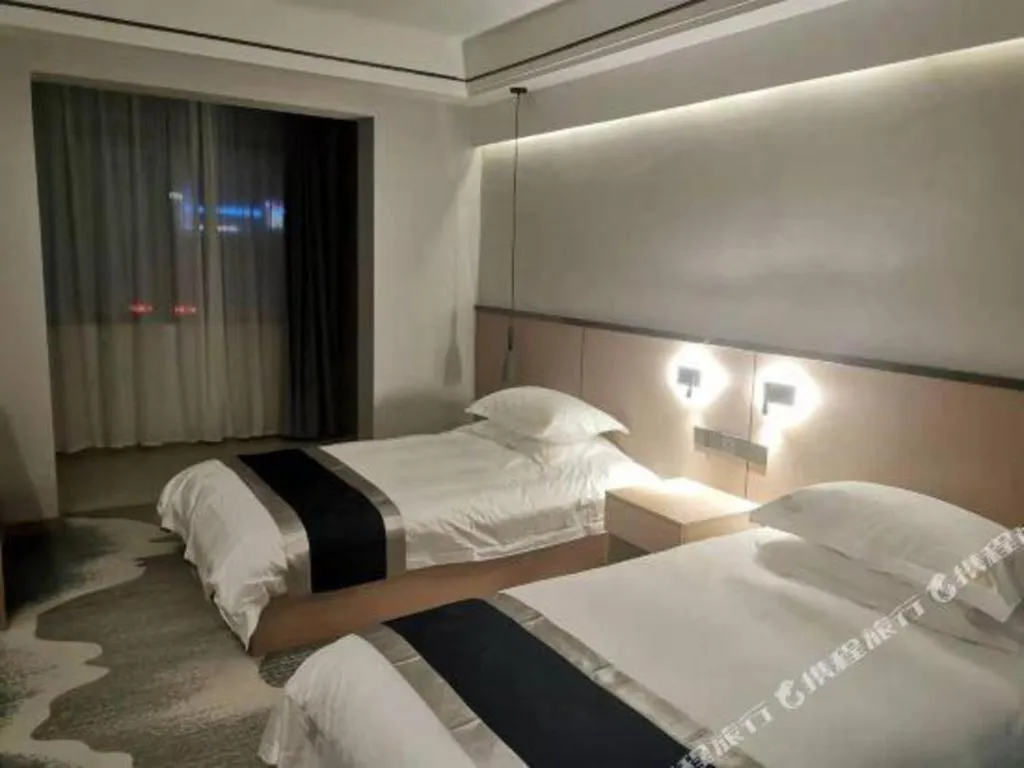 Bed in GELI Hotel Huainan Railway Station Sports Center