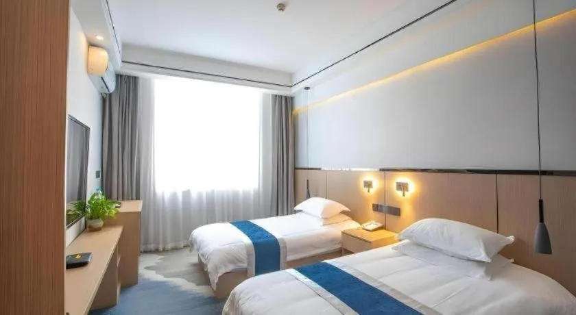 Bed in GELI Hotel Huainan Railway Station Sports Center