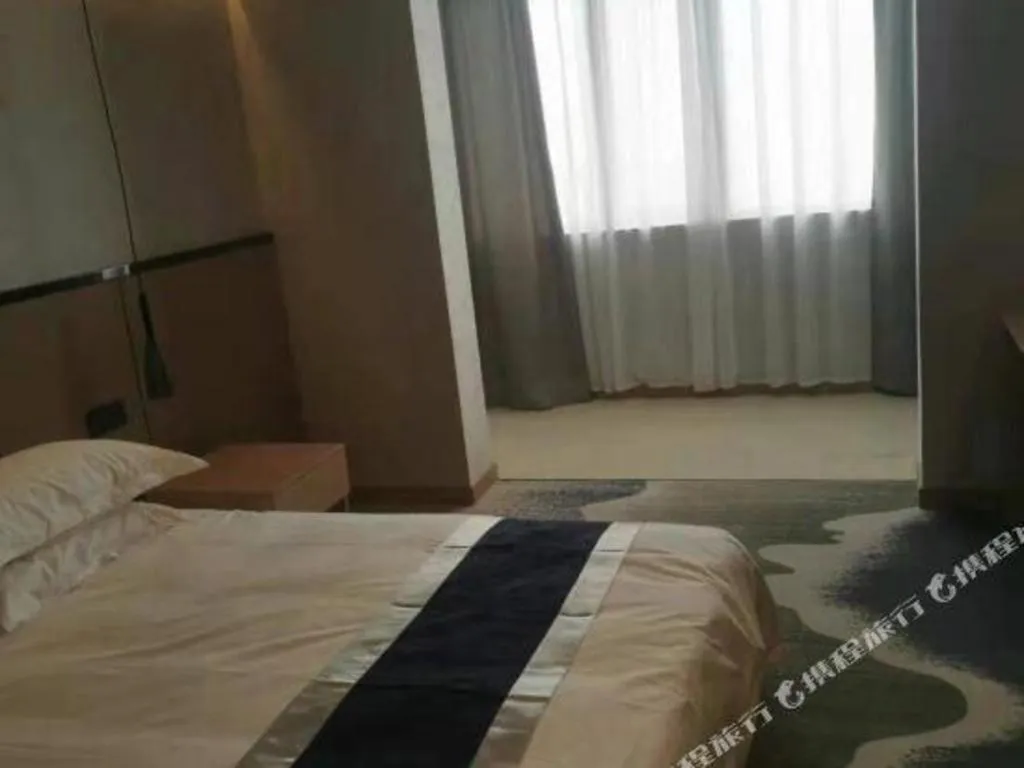 Bed in GELI Hotel Huainan Railway Station Sports Center