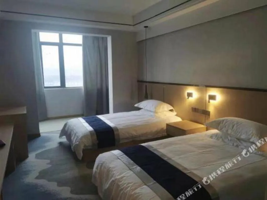 Bed in GELI Hotel Huainan Railway Station Sports Center