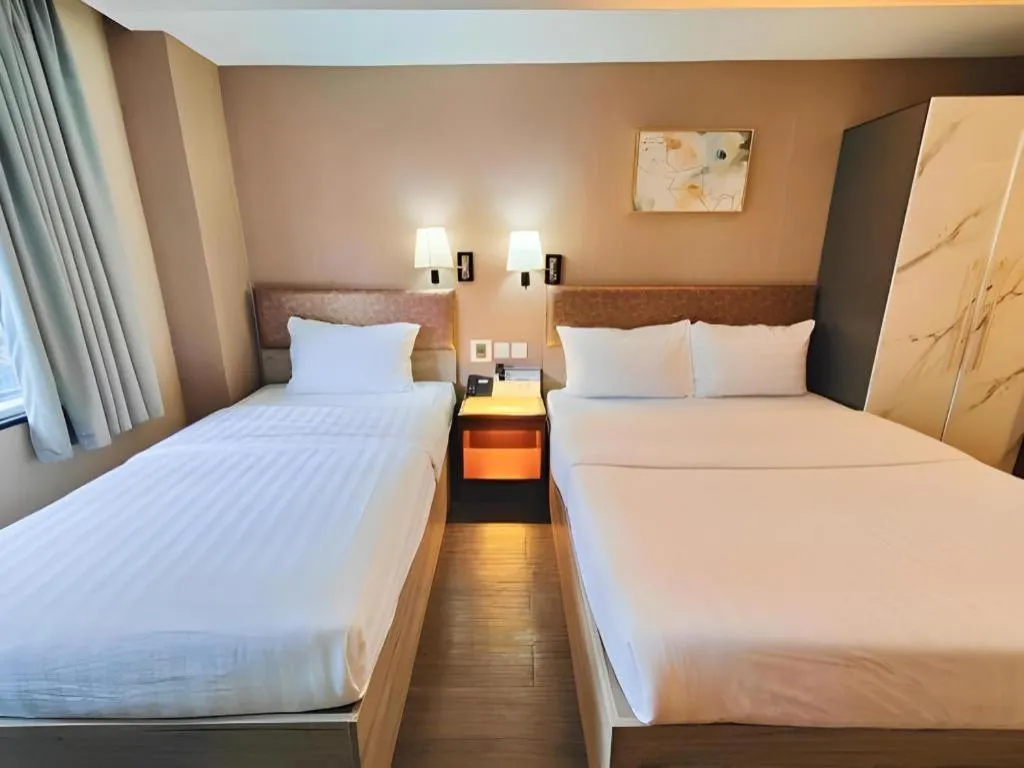 Bed in Sunny Day Hotel