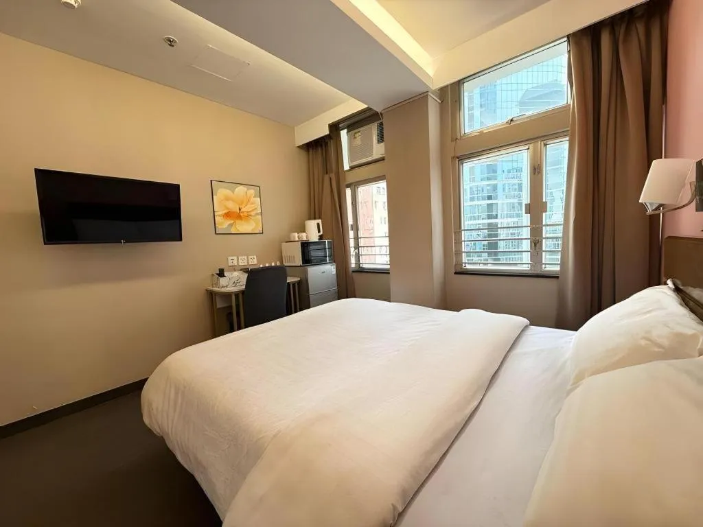 Bed in Sunny Day Hotel