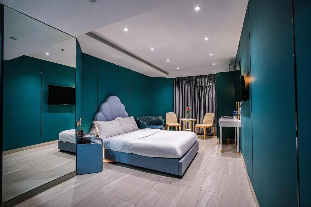 Bed in Sunny Day Hotel