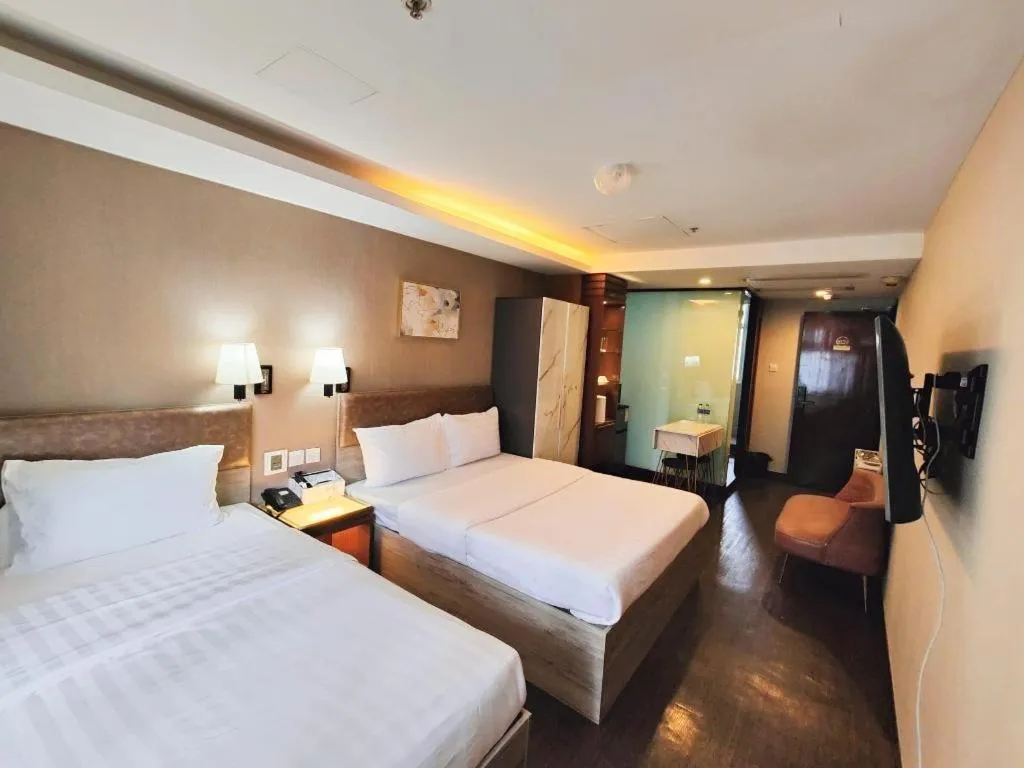 Bed in Sunny Day Hotel