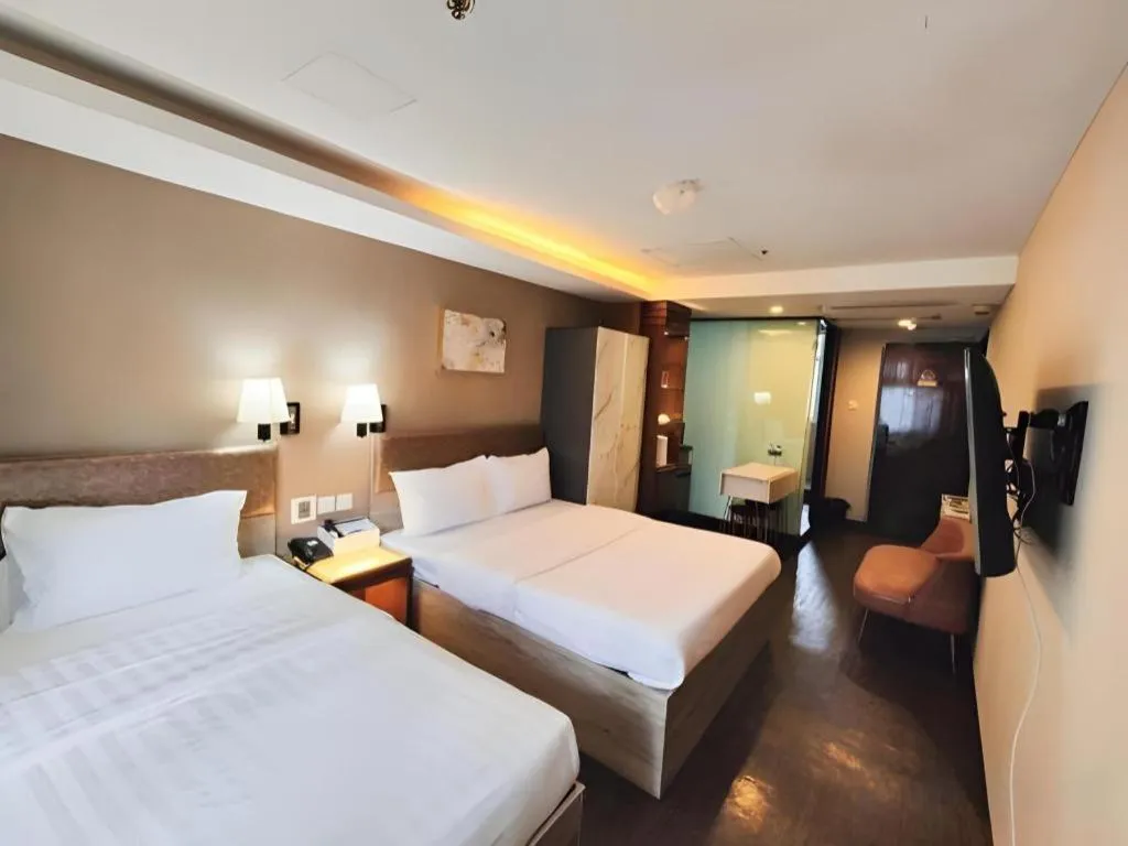 Bed in Sunny Day Hotel