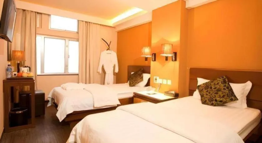 Bed in Sunny Day Hotel