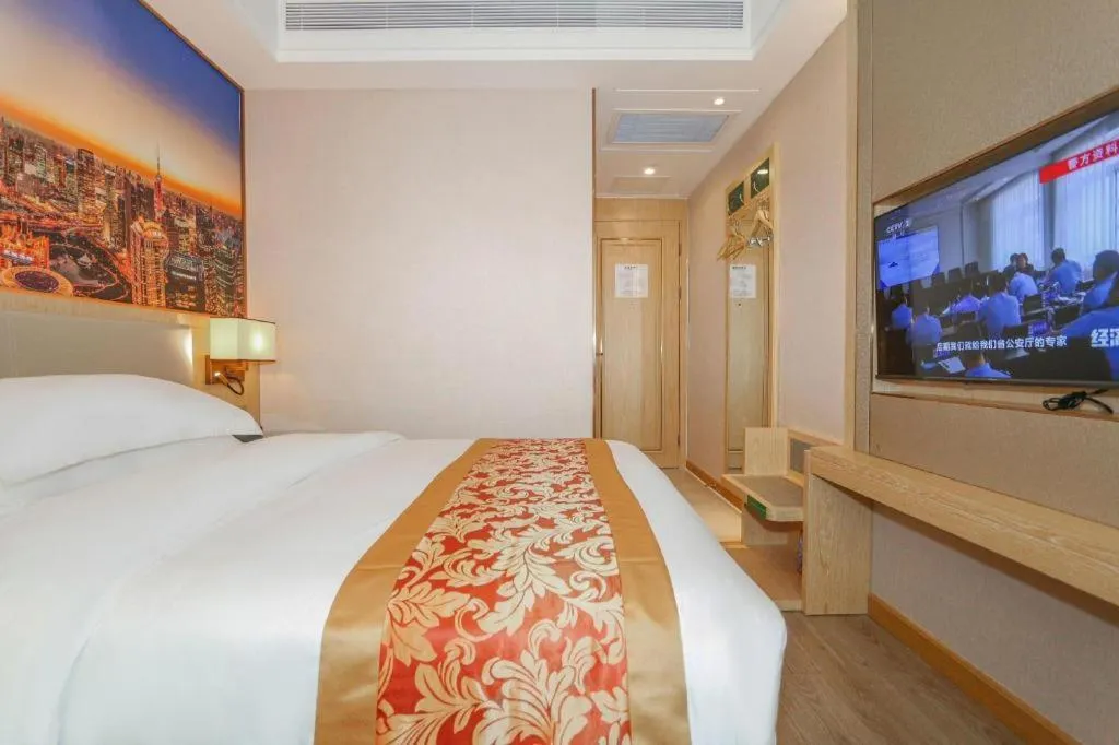 Bed in SHANGJINGHAO HOTEL （SAKATA SNOW ELEPHANT SUBWAY STATION SHOP）