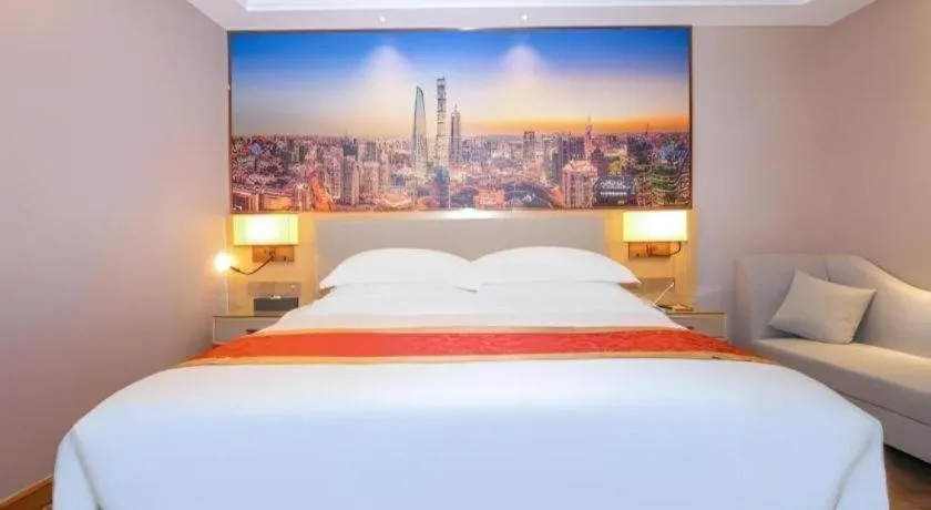 Bed in SHANGJINGHAO HOTEL （SAKATA SNOW ELEPHANT SUBWAY STATION SHOP）