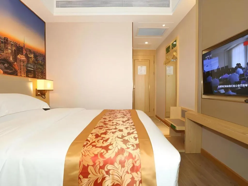 Bed in SHANGJINGHAO HOTEL （SAKATA SNOW ELEPHANT SUBWAY STATION SHOP）