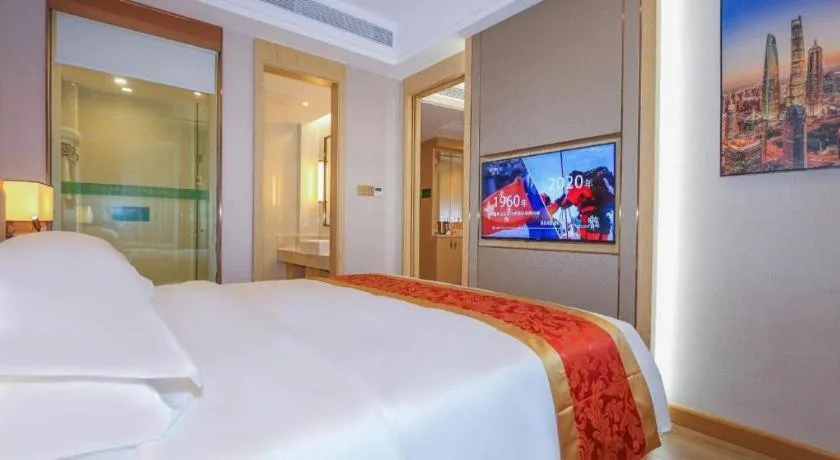 Bed in SHANGJINGHAO HOTEL （SAKATA SNOW ELEPHANT SUBWAY STATION SHOP）