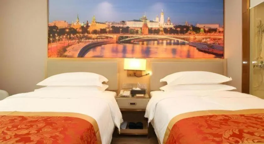 Bed in SHANGJINGHAO HOTEL （SAKATA SNOW ELEPHANT SUBWAY STATION SHOP）