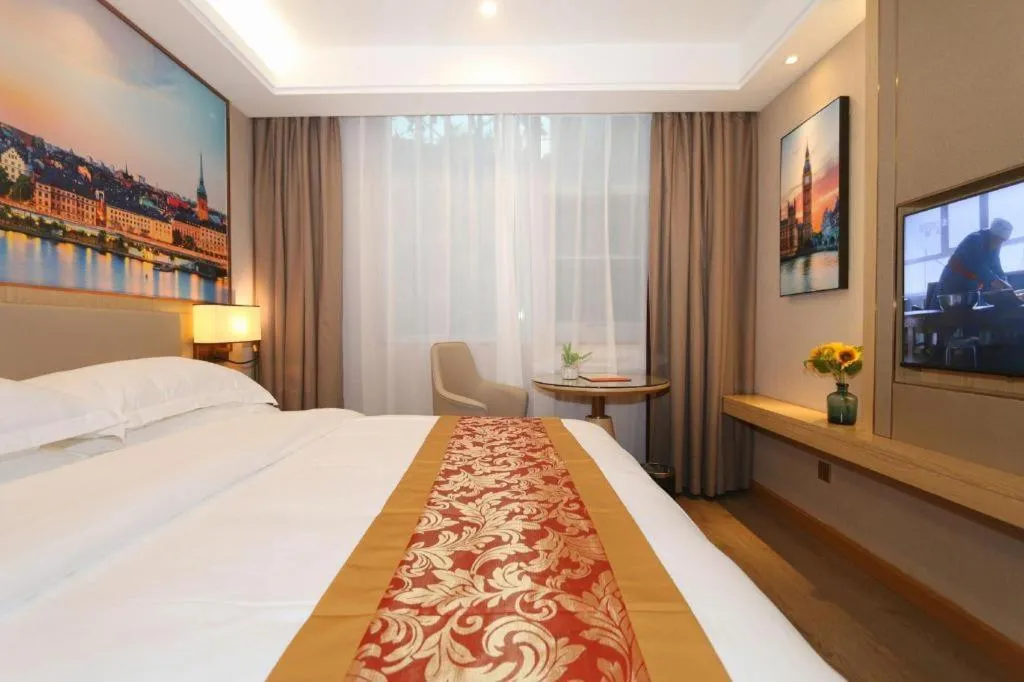 Bed in SHANGJINGHAO HOTEL （SAKATA SNOW ELEPHANT SUBWAY STATION SHOP）