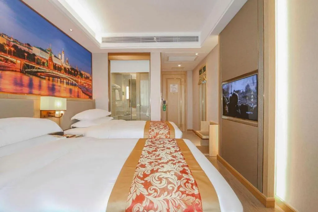 Bed in SHANGJINGHAO HOTEL （SAKATA SNOW ELEPHANT SUBWAY STATION SHOP）