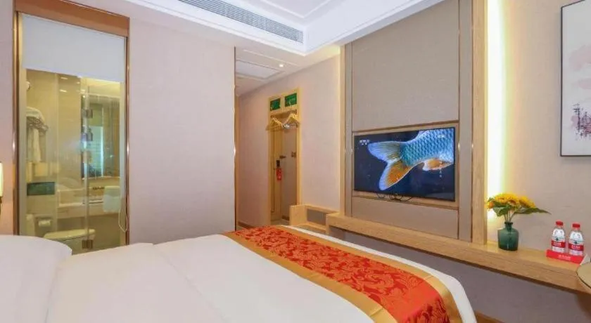 Bed in SHANGJINGHAO HOTEL （SAKATA SNOW ELEPHANT SUBWAY STATION SHOP）