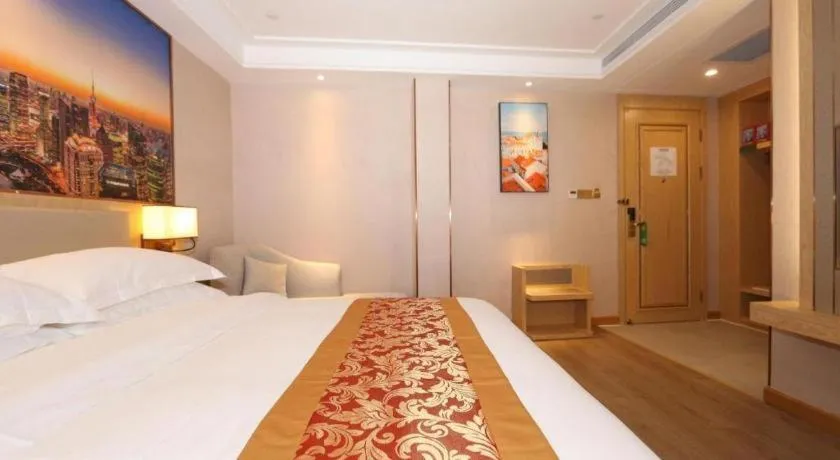 Bed in SHANGJINGHAO HOTEL （SAKATA SNOW ELEPHANT SUBWAY STATION SHOP）