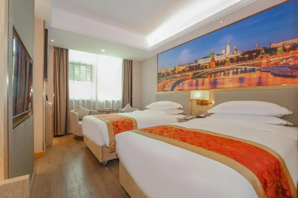 Bed in SHANGJINGHAO HOTEL （SAKATA SNOW ELEPHANT SUBWAY STATION SHOP）