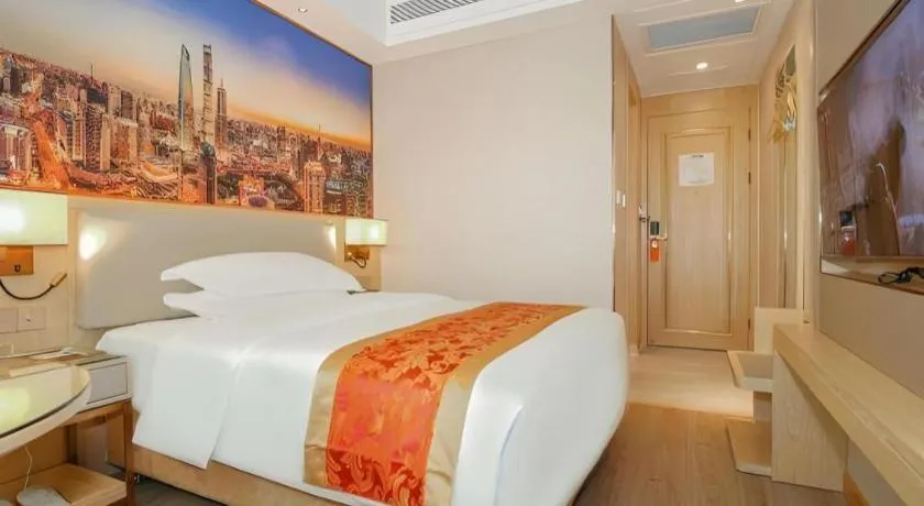 Bed in SHANGJINGHAO HOTEL （SAKATA SNOW ELEPHANT SUBWAY STATION SHOP）