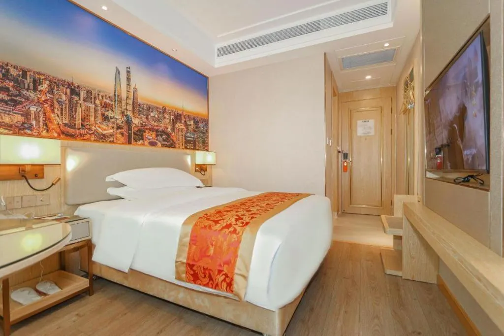 Bed in SHANGJINGHAO HOTEL （SAKATA SNOW ELEPHANT SUBWAY STATION SHOP）