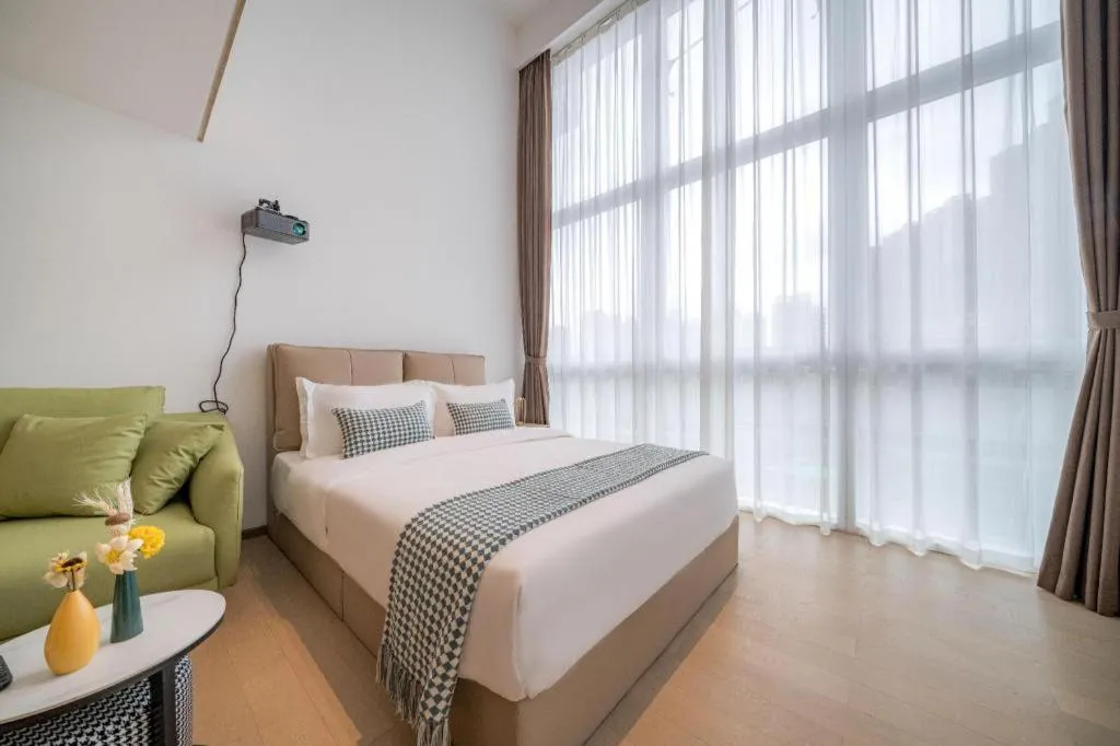 Bed in F-TOWN Fangtang Hotel (Shenzhen Longgang Tian'an Digital City Huanggekeng Subway Station)