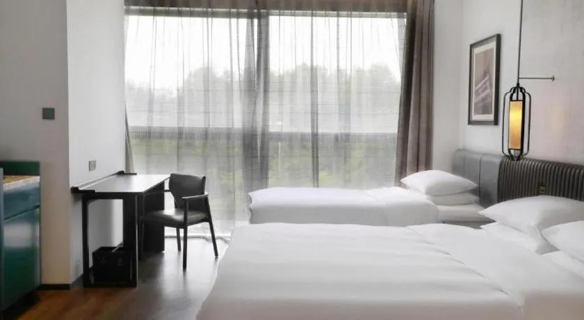 Bed in Mumian Rizhao Hotel