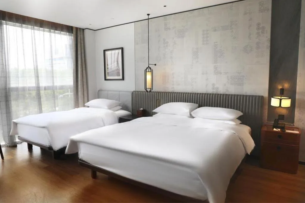 Bed in Mumian Rizhao Hotel