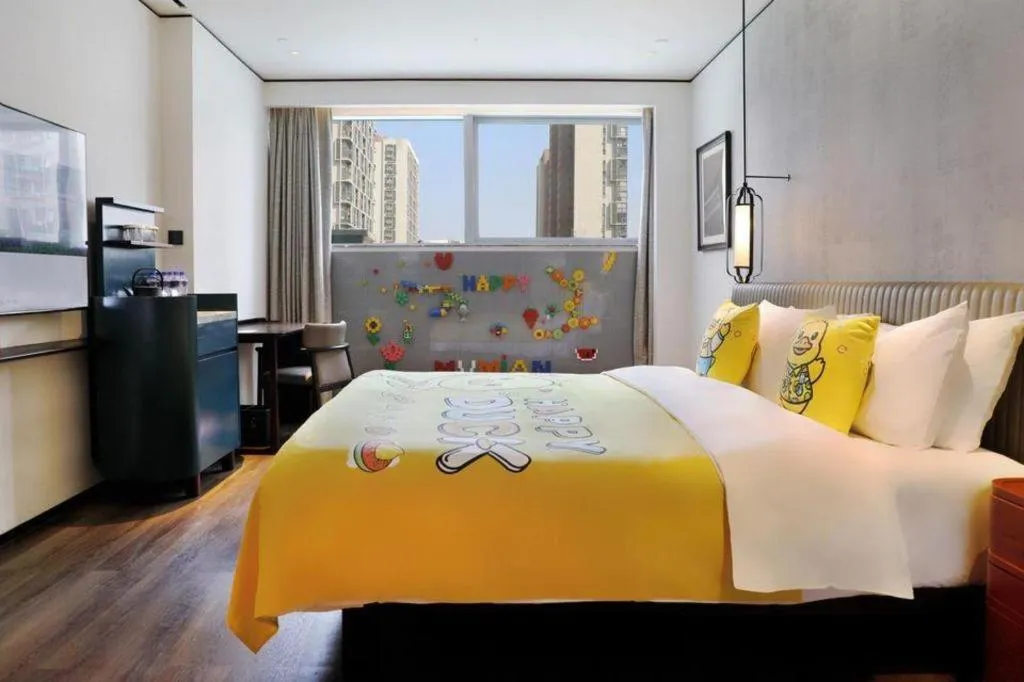 Bed in Mumian Rizhao Hotel