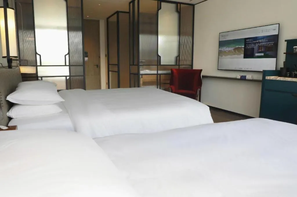 Bed in Mumian Rizhao Hotel