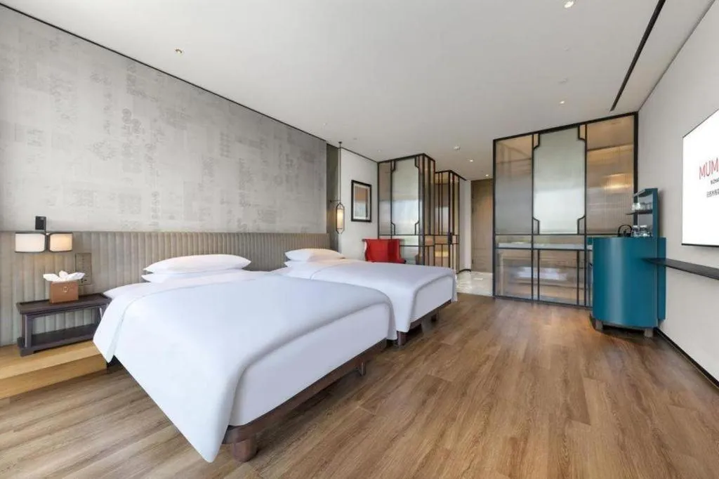 Bed in Mumian Rizhao Hotel