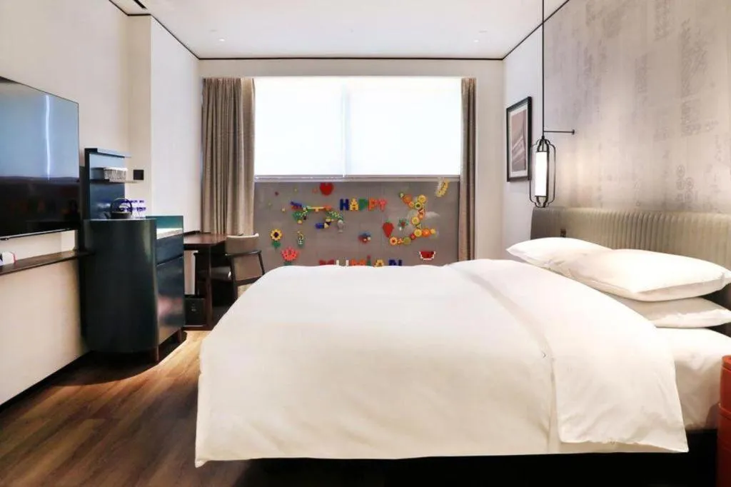 Bed in Mumian Rizhao Hotel