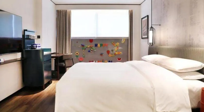 Bed in Mumian Rizhao Hotel