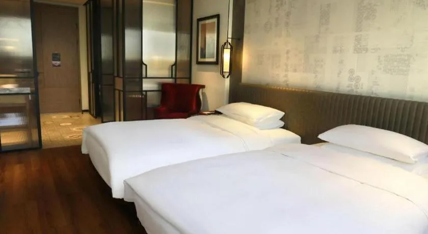 Bed in Mumian Rizhao Hotel