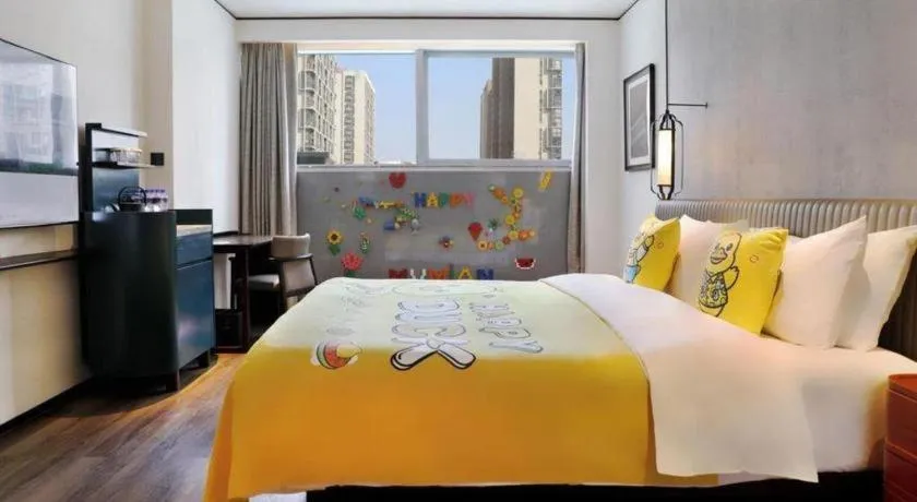 Bed in Mumian Rizhao Hotel