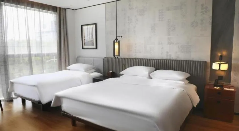 Bed in Mumian Rizhao Hotel