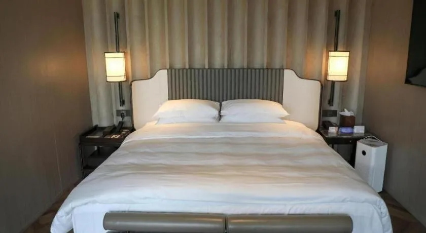 Bed in Mumian Rizhao Hotel