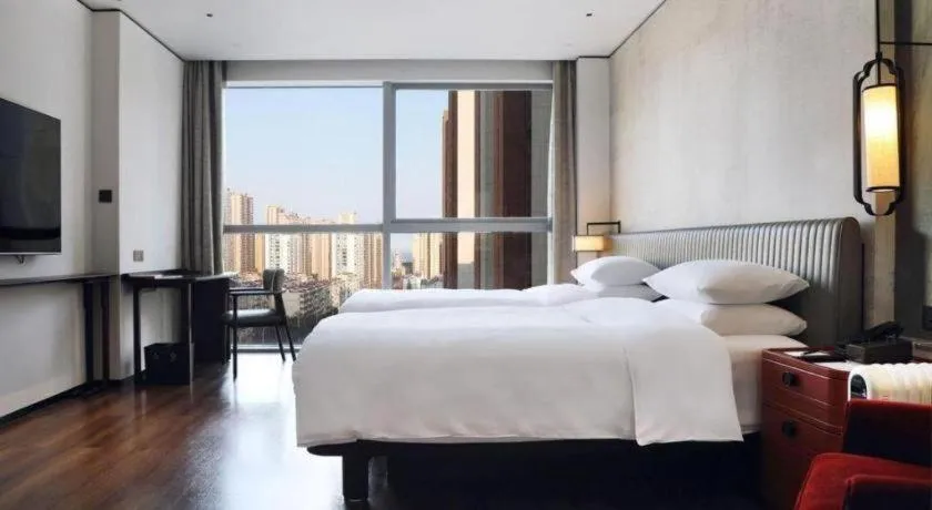 Bed in Mumian Rizhao Hotel