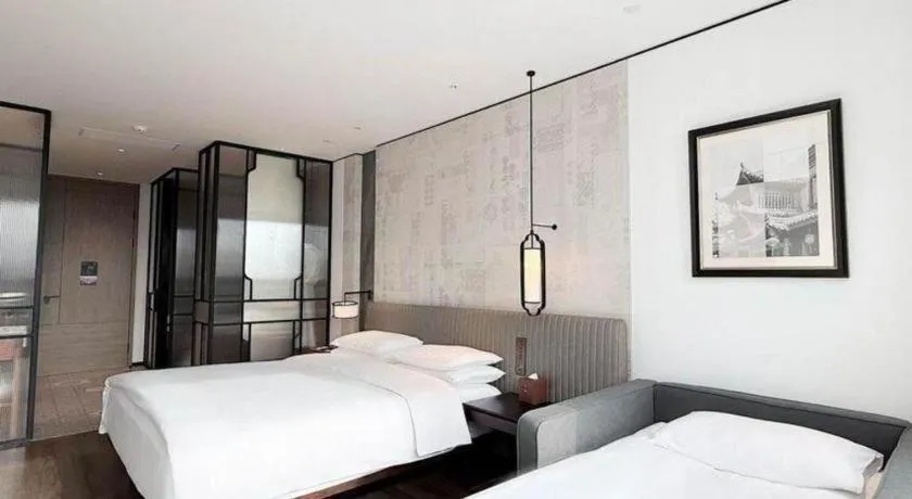 Bed in Mumian Rizhao Hotel