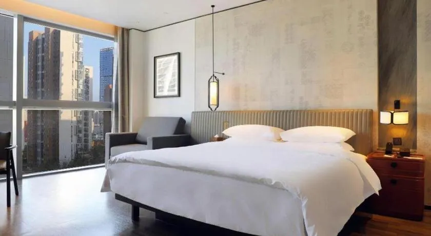 Bed in Mumian Rizhao Hotel