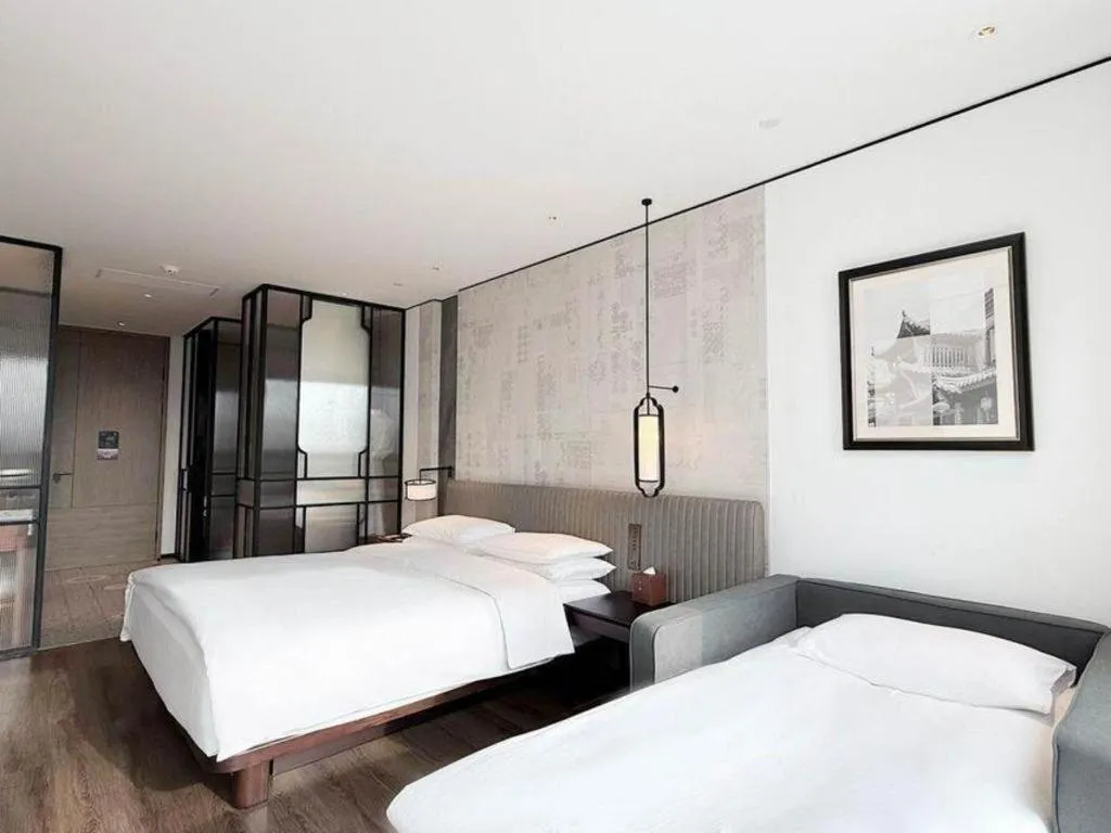 Bed in Mumian Rizhao Hotel