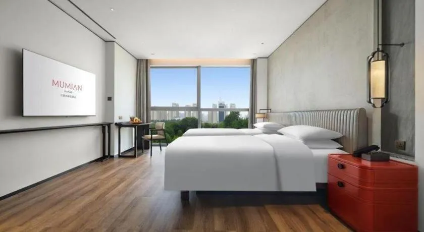 Bed in Mumian Rizhao Hotel