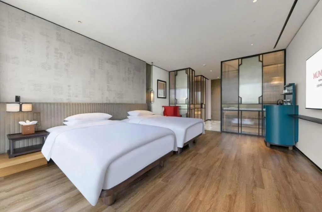 Bed in Mumian Rizhao Hotel