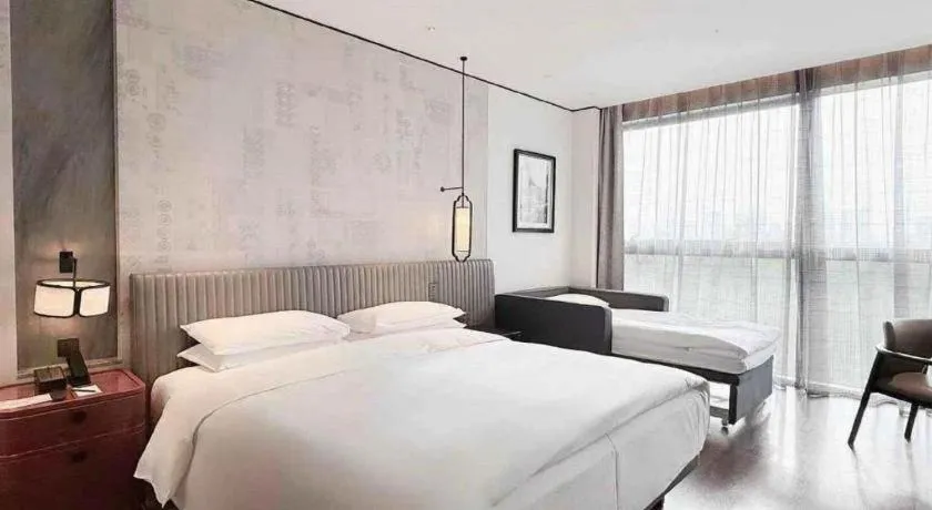 Bed in Mumian Rizhao Hotel