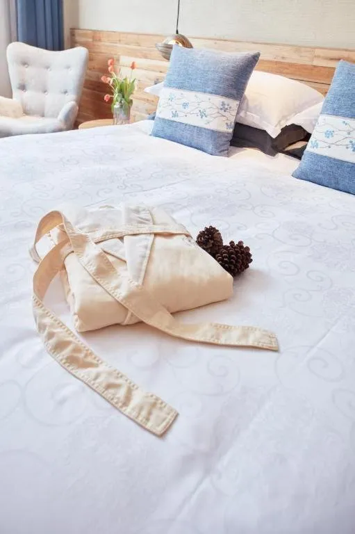 Bed in Yiqi Ecological Art Hotel Hangzhou Xixi Wetland Park Branch